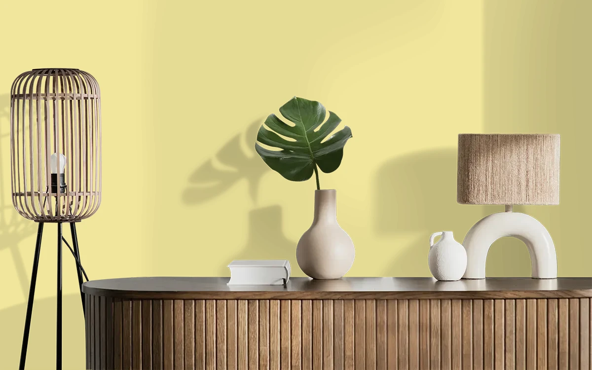 Nippon Paint's YELLOW NECKLACE color on different wall surfaces.
